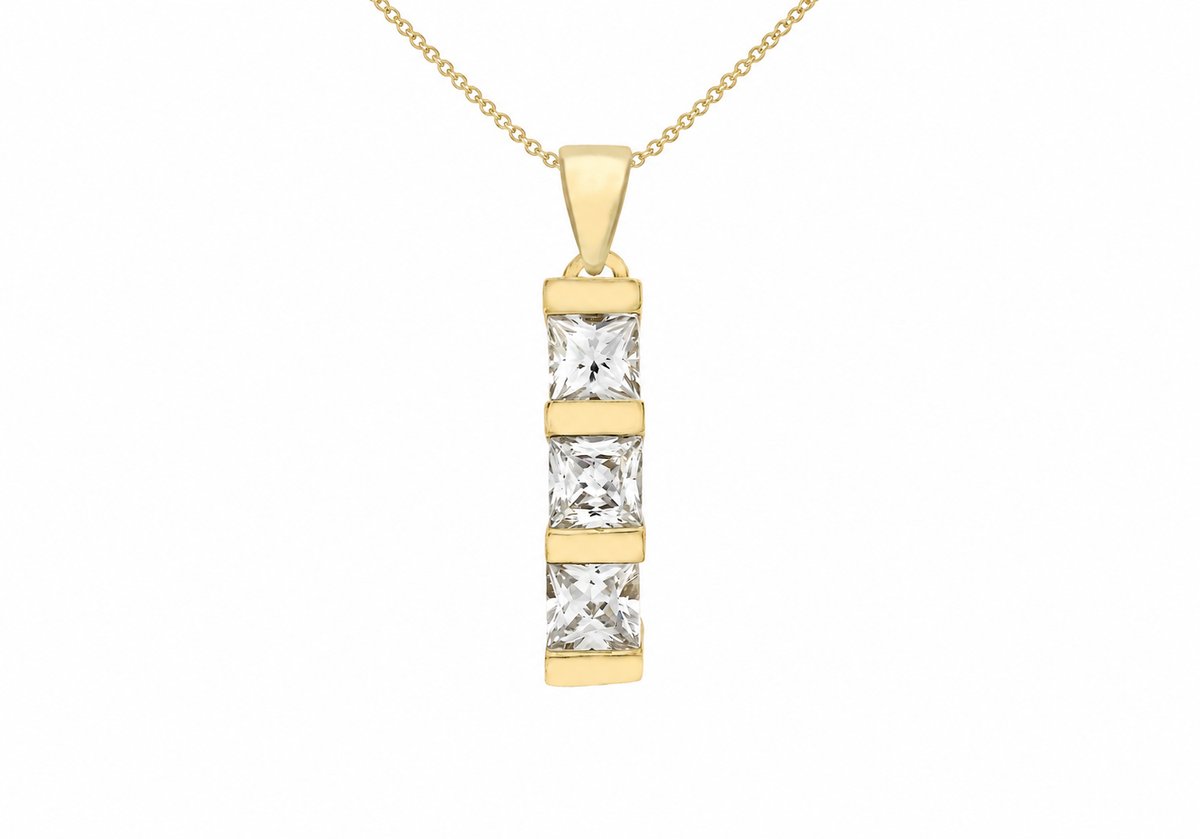 A gold pendant necklace featuring three vertically aligned princess-cut clear stones in a gold bezel setting, suspended from a delicate gold chain against a plain white background.