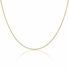 A delicate yellow gold chain necklace forming a U-shape against a clean white background with a soft reflection below.