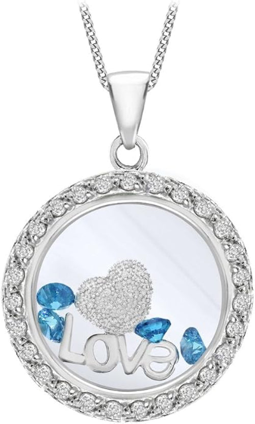 A round silver pendant necklace featuring a silver heart, blue rhinestones, the word 'Love' in silver letters, and a border of small clear stones, suspended from a silver chain.