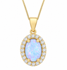 A yellow gold oval pendant necklace featuring a central iridescent white opal surrounded by a halo of small clear stones, suspended from a gold chain on a white background.