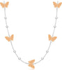 A delicate silver chain necklace featuring five textured rose gold butterfly charms spaced along the chain, set against a solid white background.