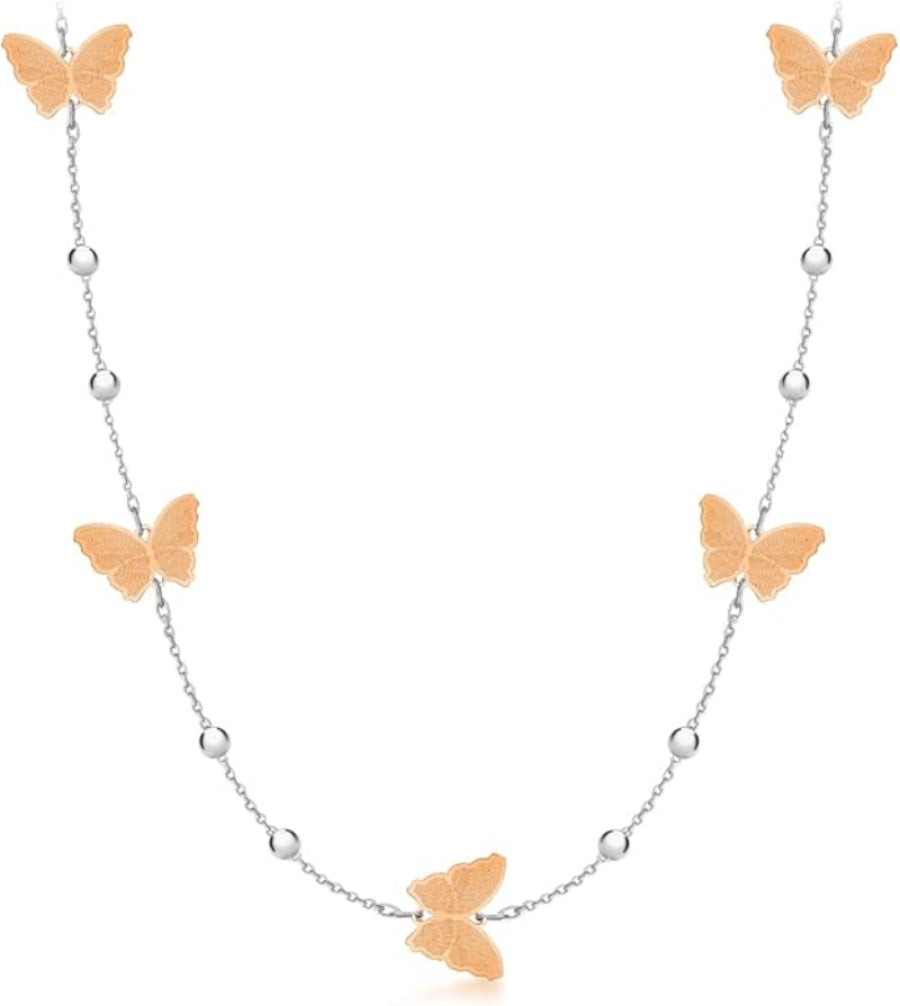 A delicate silver chain necklace featuring five textured rose gold butterfly charms spaced along the chain, set against a solid white background.