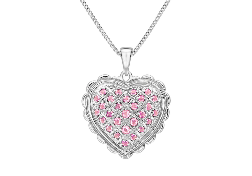 A silver heart-shaped pendant necklace featuring a grid pattern of small pink gemstones, suspended from a delicate silver chain against a light gray background.